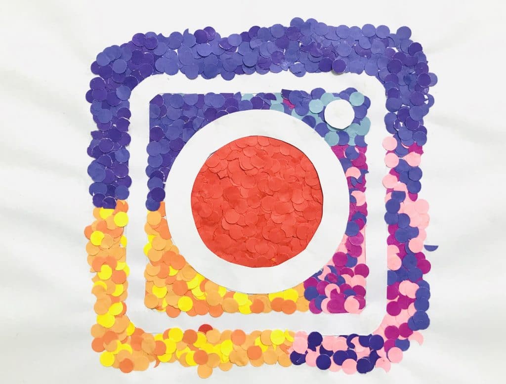 Instagram logo made out of small coloured pieces of paper